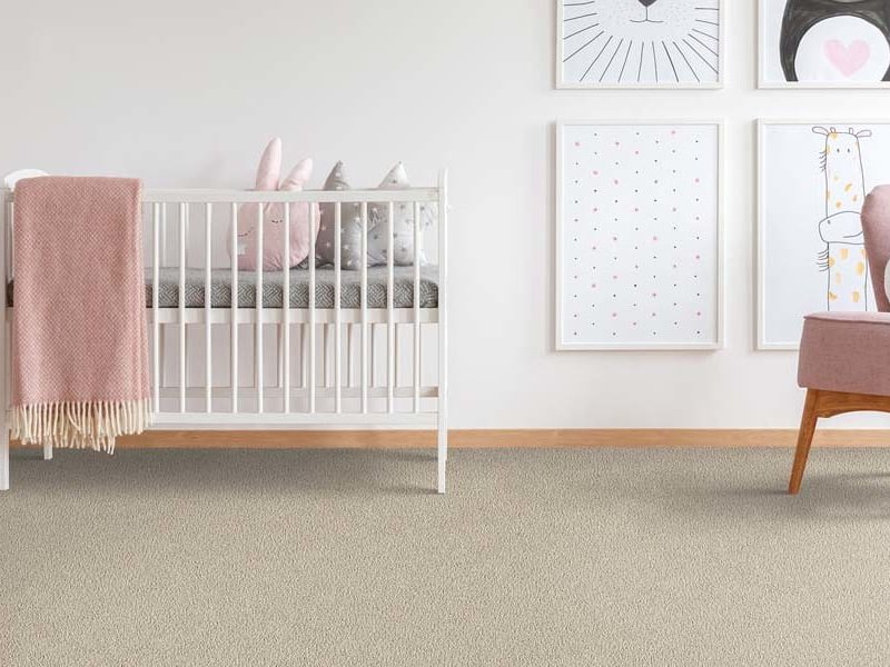 Nursery with soft carpet flooring