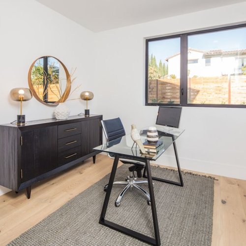 Home office with rustic hardwood floors