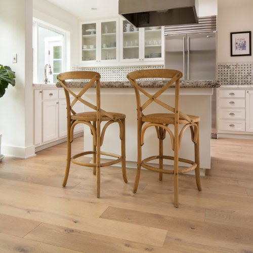 Bright kitchen with new hardwood floors installed by Solana Flooring
