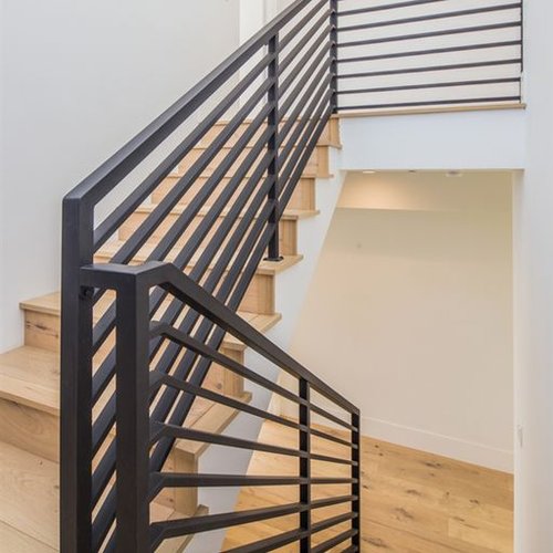 Hardwood flooring on stairs in a modern Solana Beach home