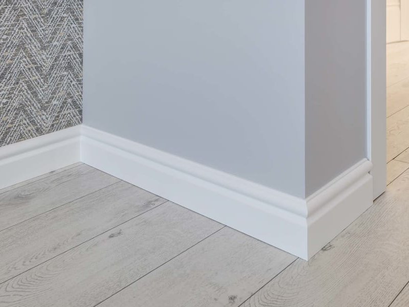 Baseboard and new flooring by Solana Flooring