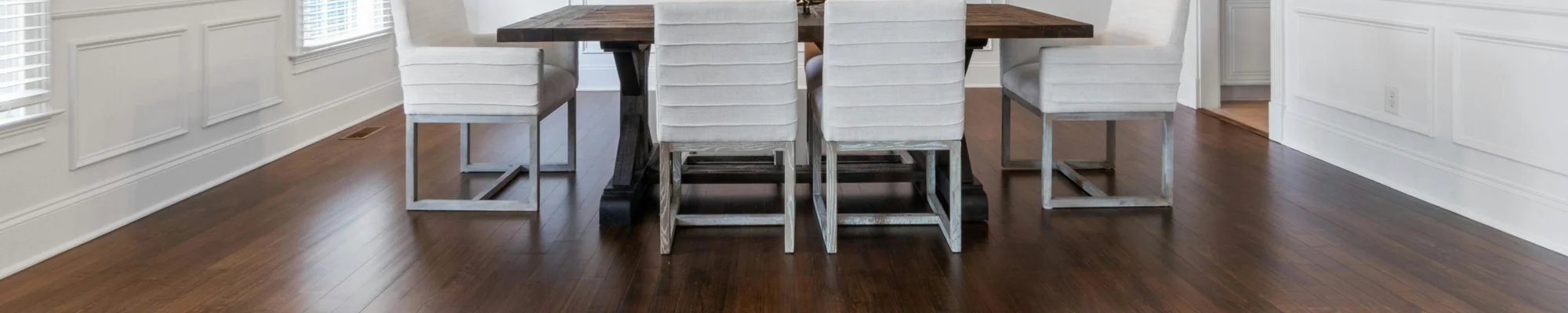 Formal dining room with dark wood flooring in a Solana Beach CA home
