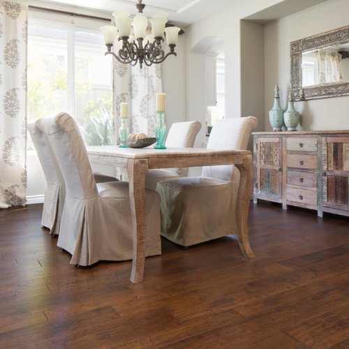Traditional Solana Beach CA dining room with dark wood flooring
